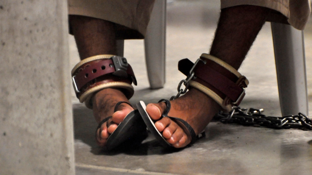 A Guantanamo detainee's feet are shackled to the floor as he attends a class inside Camp Six, a high-security detention facility at Guantanamo Bay [File Photo: Michelle Shephard/Reuters]