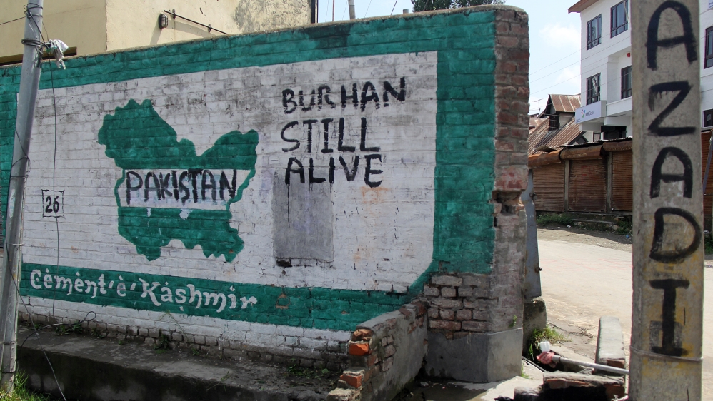 Graffiti on a wall in the southern Anantnag district shows all five regions of Kashmir under Pakistan [Aarabu Ahmad Sultan/Al Jazeera]