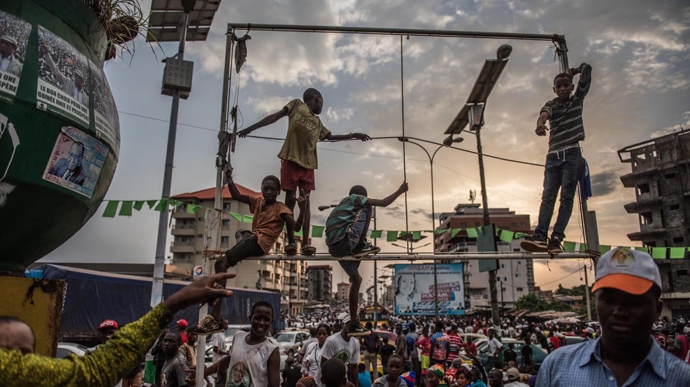 An opposition rally. Guinea has become a democracy but it is still in the process of building a sense of national unity [Tommy Trenchard/Al Jazeera] 