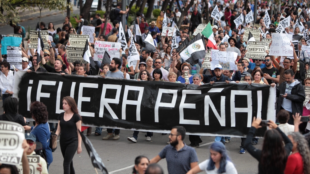 Thousands of people march against President Pena Nieto