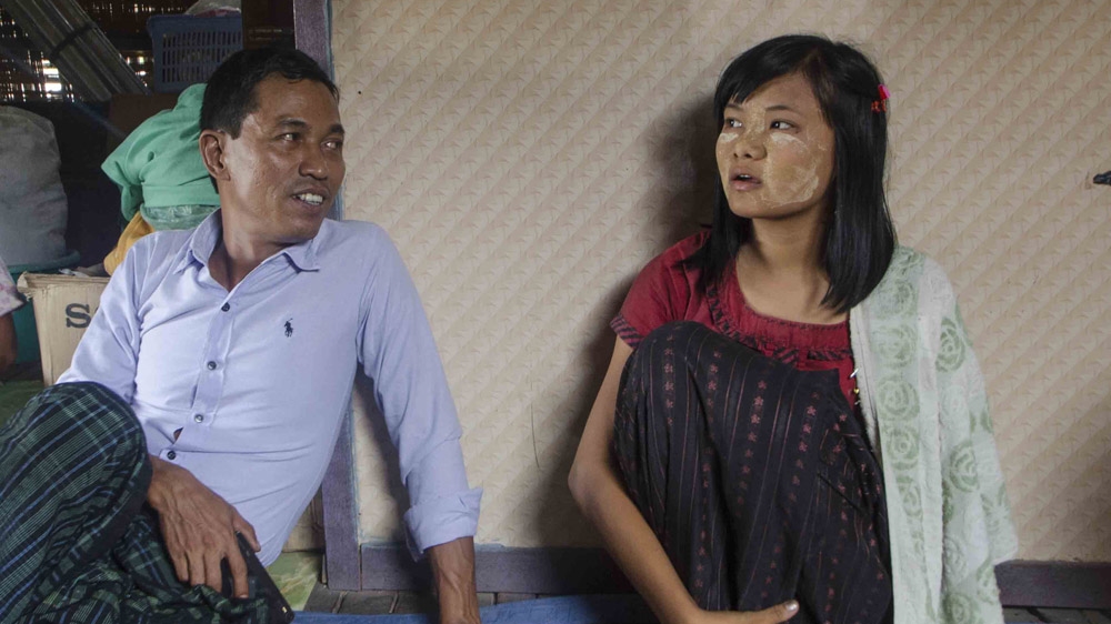 Ko Taw, left, is determined to fight for workers rights in Myanmar. Zin Mar Htwe, right, lost her arm in an hydraulic press while working at a steel factory [Charles Turner/Al Jazeera]