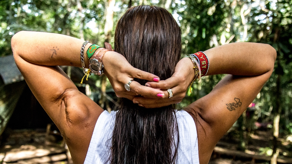 Estefany remembers lost comrades [Tomas Ayuso/Al Jazeera] 