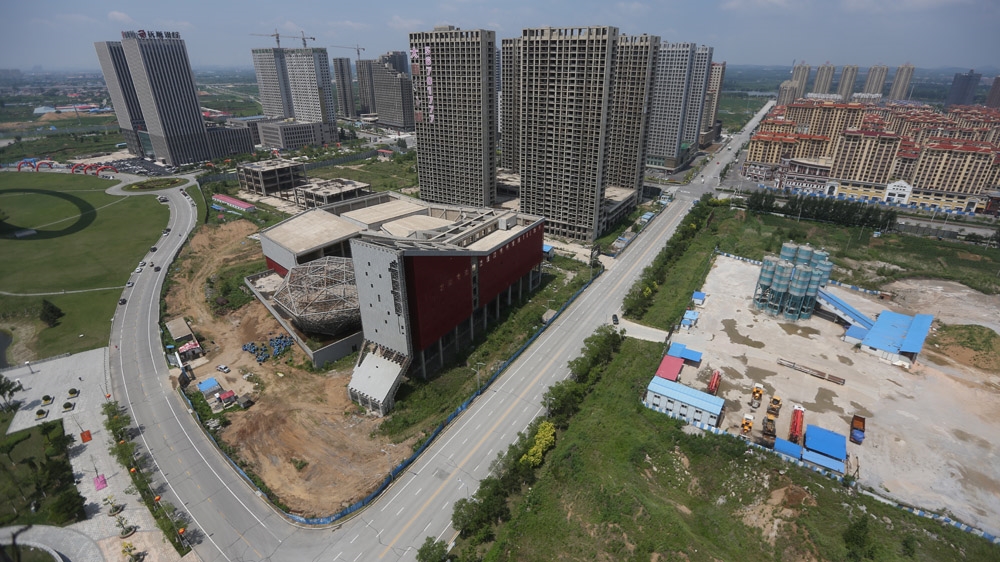 Across China many skeletal concrete structures are still waiting for polished veneers to be put on [Steve Chao/Al Jazeera] 