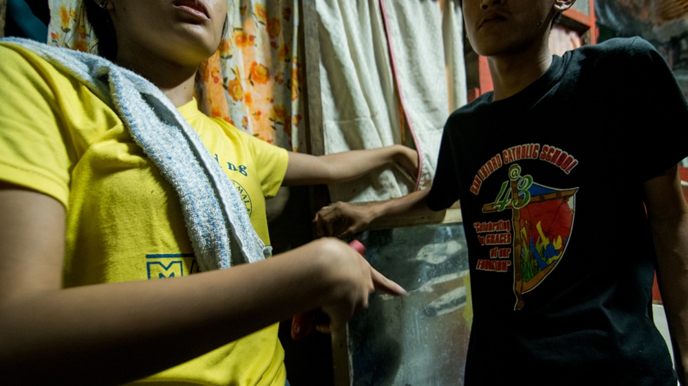 Neighbours recall moments leading to the death of rickshaw driver Eric Sison [ Martin San Diego/Al Jazeera]