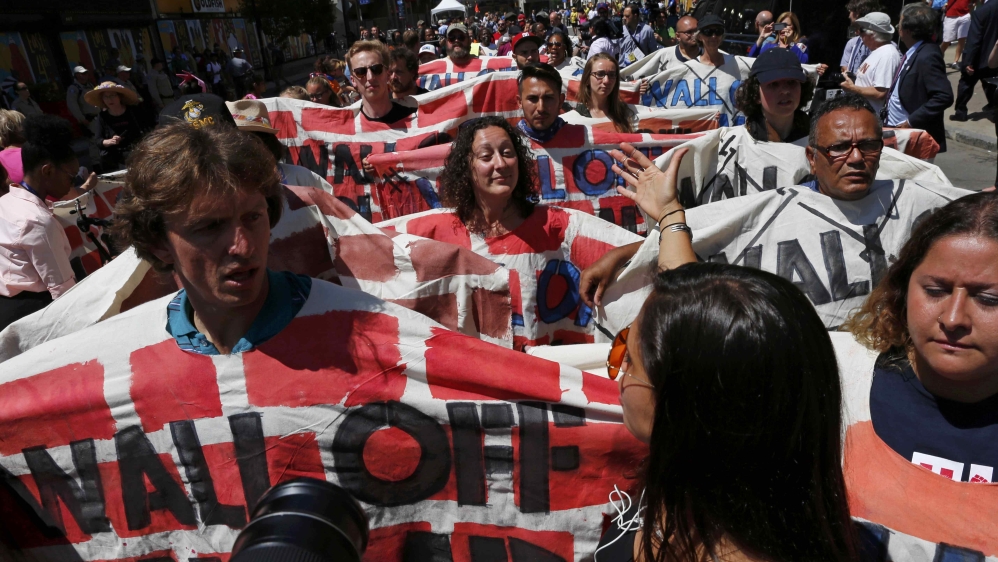 Demonstrators protesting against the immigration policies of Republican U.S. presidential nominee Donald Trump march outside the arena hosting the Republican National Convention in Cleveland