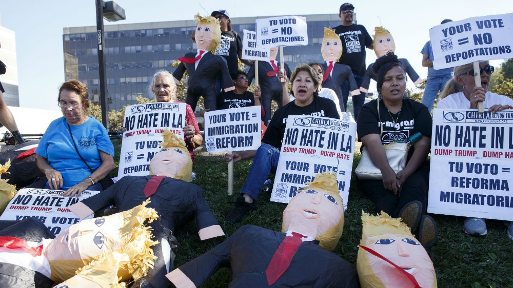 Protesters gathered in Los Angeles, urging Latinos in the US to register to vote against Trump [Eugene Garcia/EPA]