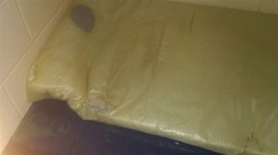 Ra-Sun sleeps on an old mattress on a concrete slab [ Ra-Sun's photography]