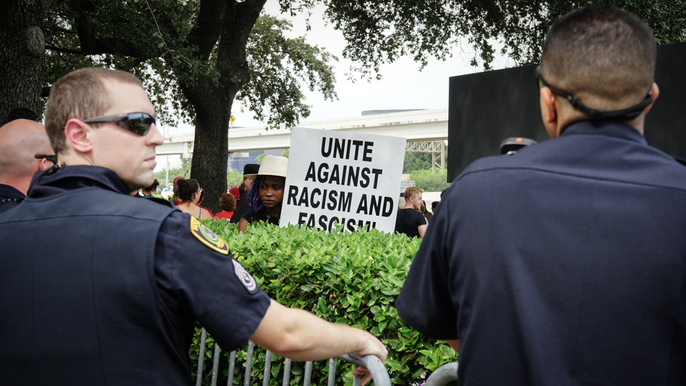 Hundreds of police officers surrounded the area to prevent clashes between protesters [Patrick Strickland/Al Jazeera]