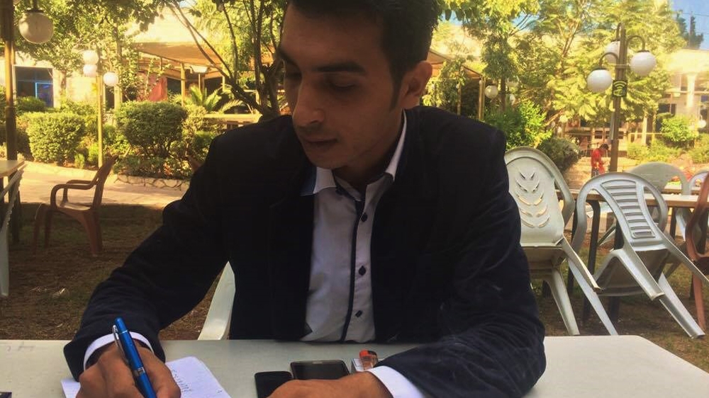 
 Aqeel Awawadi believes that if he had stayed at Sanabel Radio, he would now be in prison with his colleagues [Sheren Khalel/Al Jazeera]  
