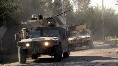 Afghan security officials patrol in Aachin district of Kunduz, Afghanistan [EPA]