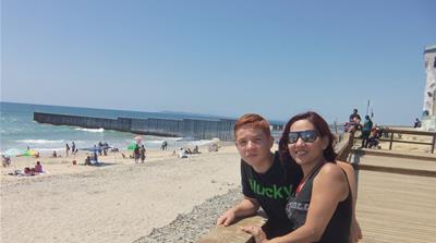 Emma Sanchez and her oldest son Alex [John Dickie/Al Jazeera]