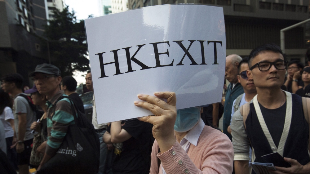 The situation is seen among many as one of the biggest tests the global financial hub has faced since its handover to China [EPA]