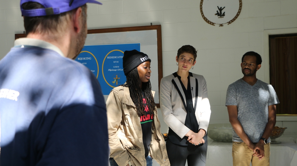 Jasmine Wright, centre, is an organiser for the nonprofit Democracy North Carolina's 'Souls to the Polls', a grassroots effort to get people of faith out to vote [Julienne Gage/Al Jazeera]