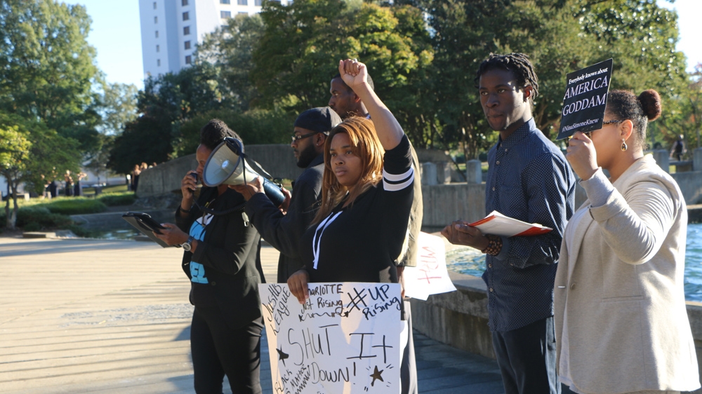 Protesters at a rally organised by Charlotte JustUS League [Julienne Gage/Al Jazeera]