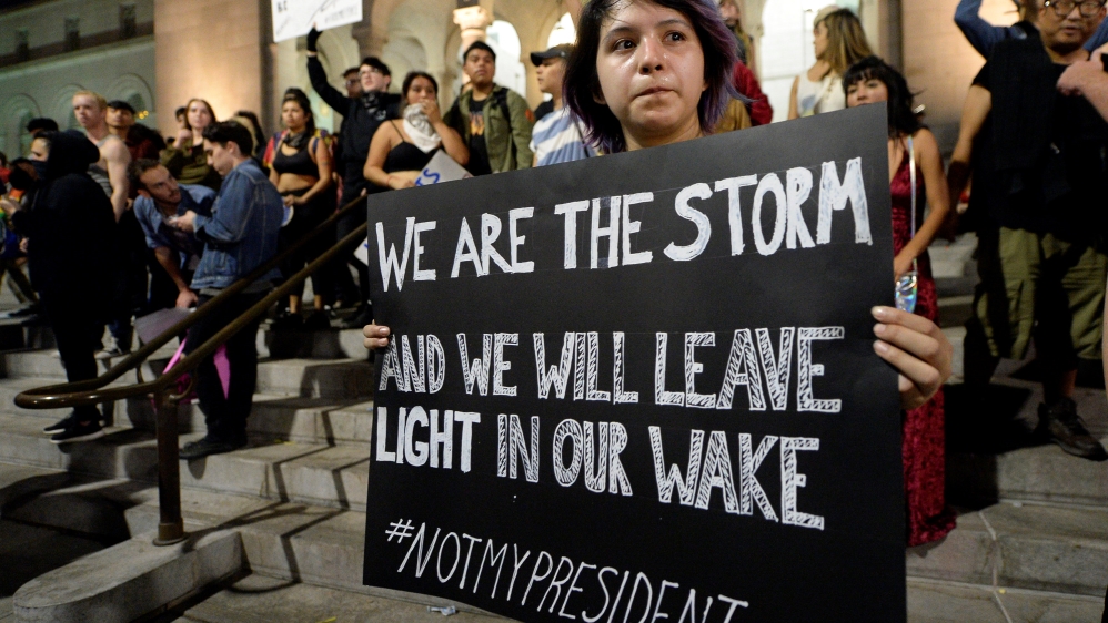 A protestor holds a sign during a rally against the election of Republican Donald Trump as President of the United States in Los Angeles
