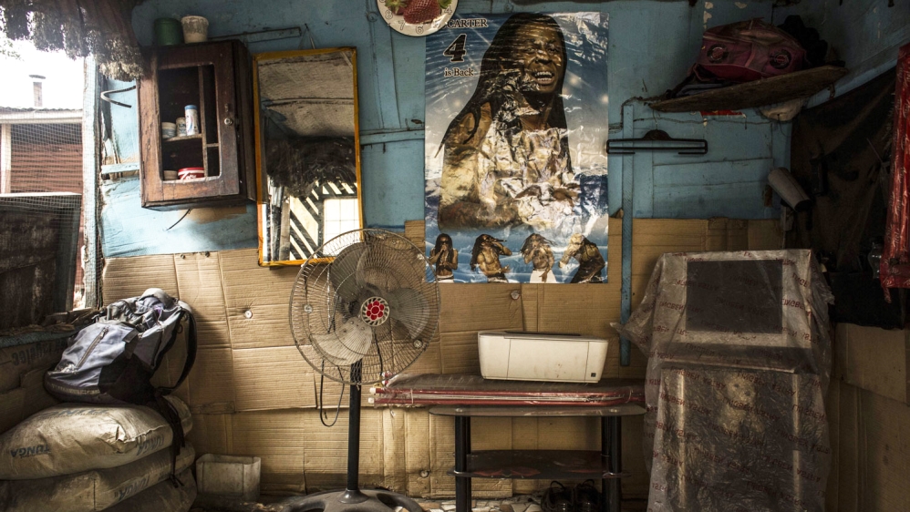 Kris Bitenda's barbershop, where he also draws tattoos, in the Lubugi district in Kinshasa [Francesca Volpi/Al Jazeera]
