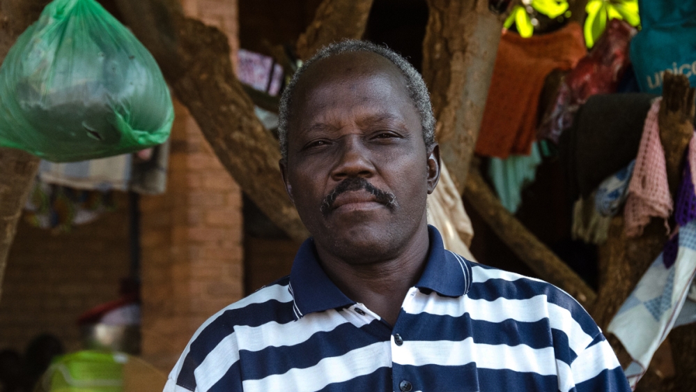 Father Natale Gurucho, a priest at St Mary’s Cathedral, took his car to collect dead bodies from the hospital and bury them in the church grounds. [Richard Nield/Al Jazeera]