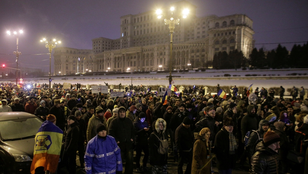People take part in a demonstration to protest against government plans to reform some criminal laws through emergency decree, in Bucharest