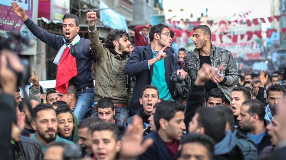 Demonstrators in northern Gaza's Jabaliya refugee camp march to protest against power cuts [Ezz Zanoon/Al Jazeera]