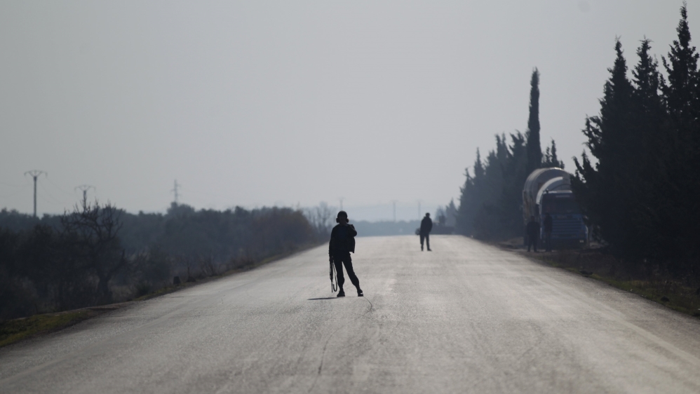 Fighters from "Jaish al Fatah" secure a road in Idlib