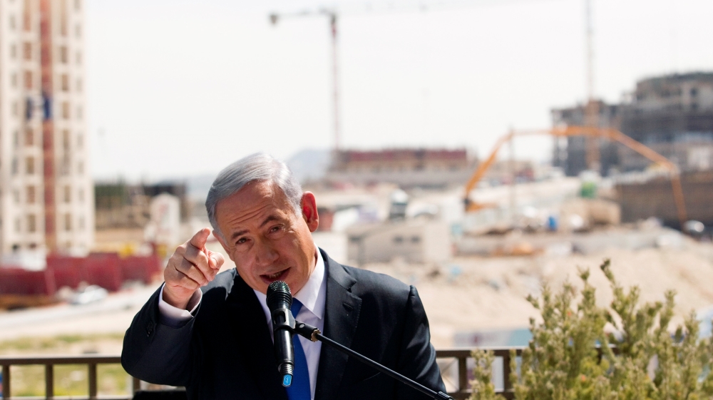 FILE PHOTO: Israeli Prime Minister Benjamin Netanyahu delivers a statement in front of new construction, in the Jewish settlement known to Israelis as Har Homa and to Palestinians as Jabal Abu Ghneim