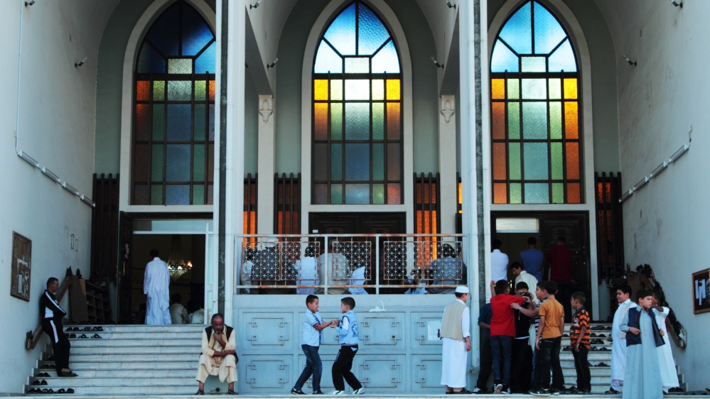  Looking out my window I see everyday life continuing, with its busy shops, heavy traffic ...   [Gaia Anderson/AP]