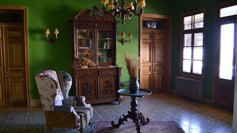 Palmyra Hotel's owners strive to preserve the hotel with its  creaking beds, gurgling pipes and ancient furnishings    [India Stoughton/Al Jazeera]