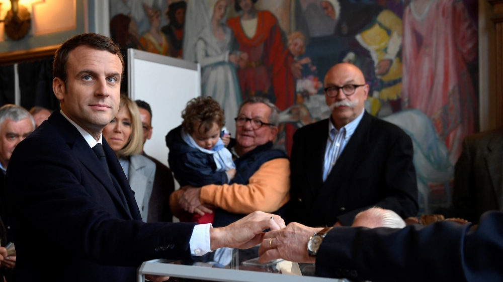 A Macron presidency would generally be a continuation of the status quo, with a nod to the progressive currents emerging in the US and Britain [Reuters/Eric Feferberg]