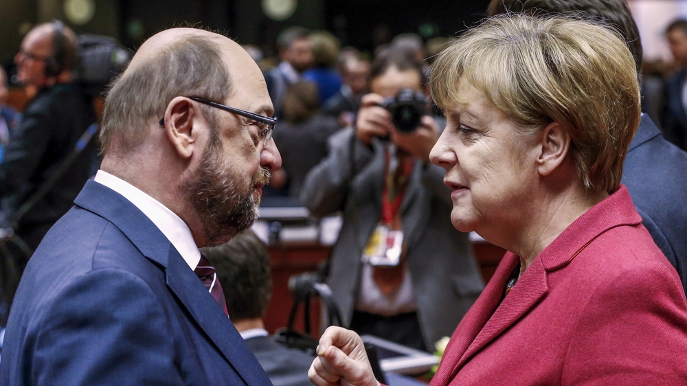 SDP leader and former European Parliament President Martin Schulz (L) and German Chancellor Angela Merkel (R)