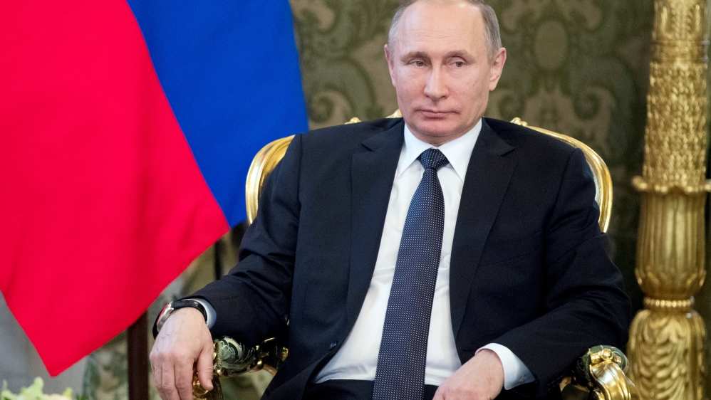 Russian President Vladimir Putin listens to Uzbek President Shavkat Mirziyoyev (not pictured) during a meeting in Moscow''s Kremlin