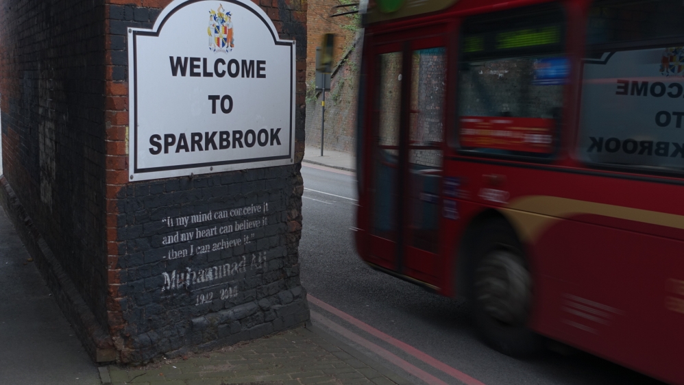 A quote by US boxer Muhammad Ali greets visitors entering Sparkbrook [Shafik Mandhai/Al Jazeera]