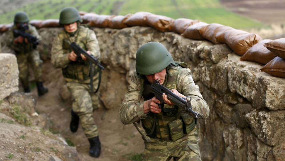 Turkish soldiers participate in an exercise on the border line between Turkey and Syria near the southeastern city of Kilis