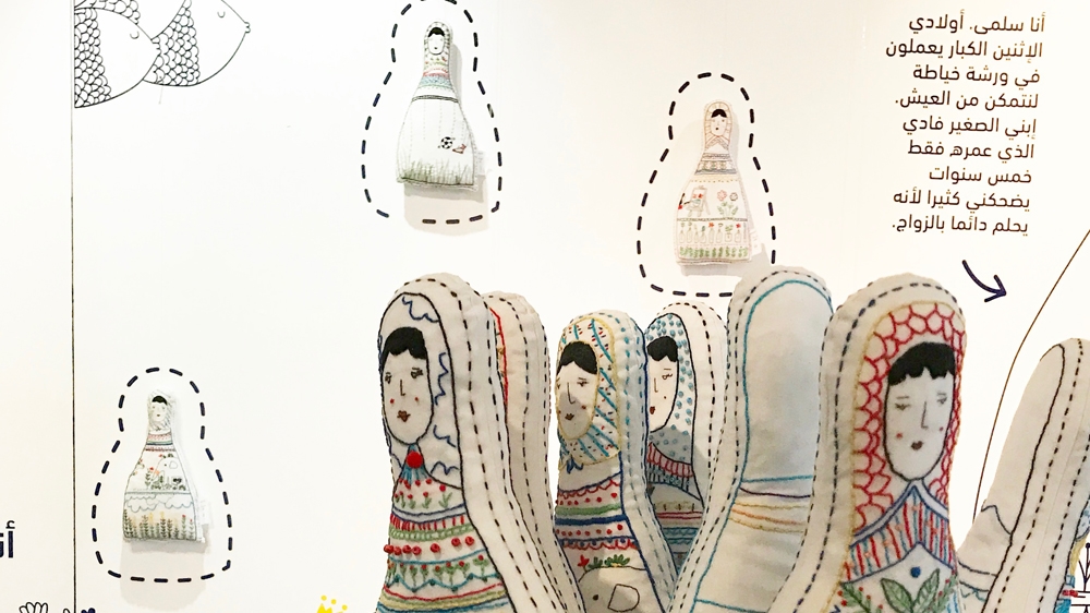 Salma's older children work at a tailoring business to make ends meet. Her youngest son, five-year-old Fadi, already dreams of getting married [Courtesy of the Ana Collection/Al Jazeera]Manhal's doll tells of a mother's struggle to support her children after the death of her husband [Courtesy of the Ana Collection/Al Jazeera]