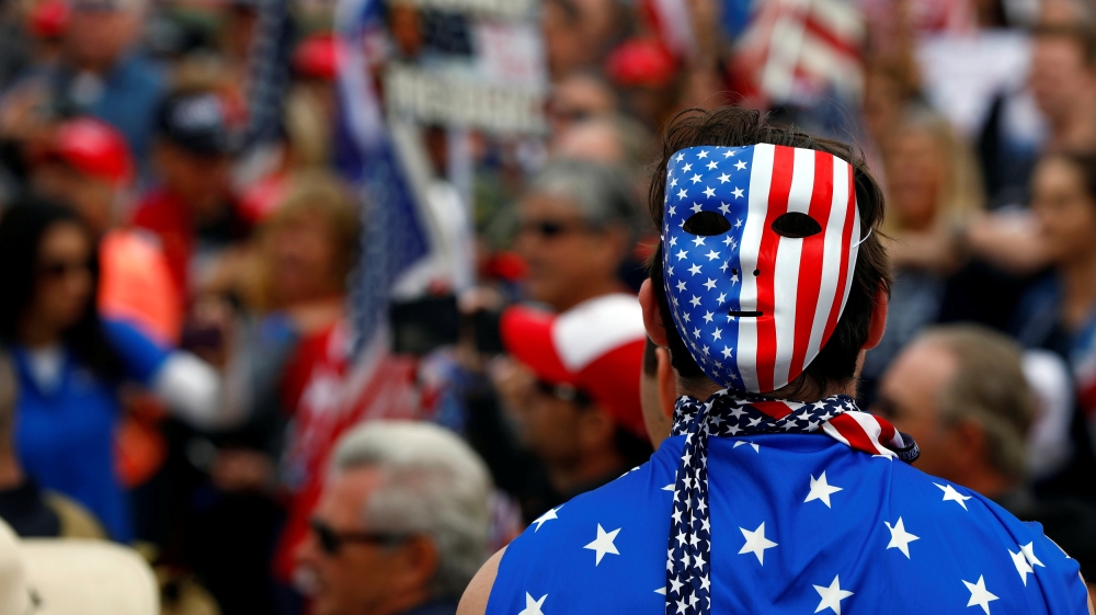 A pro-Trump rally participant wears a U.S.