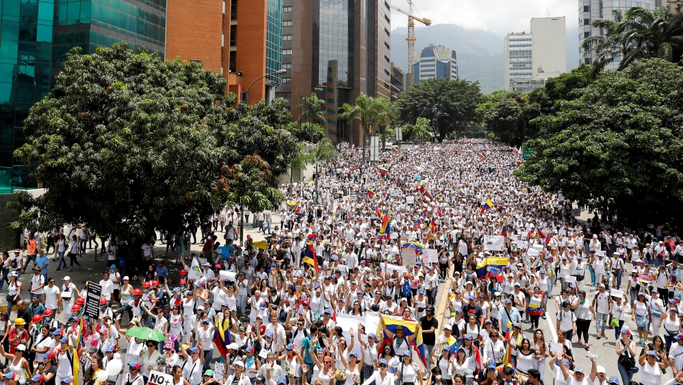 Demonstrators attend a women''s march to protest against President Nicolas Maduro''s government in Caracas,