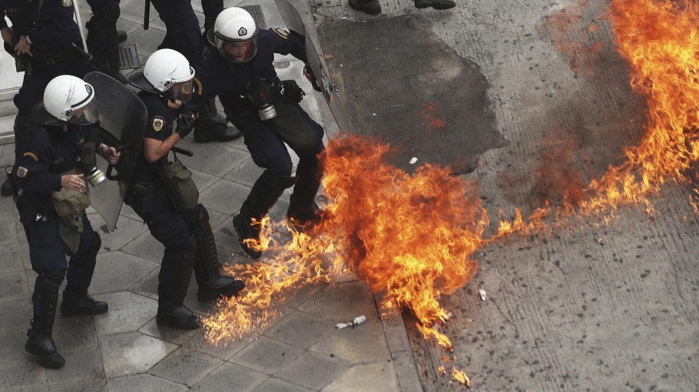 Police said almost 12,000 protesters turned up on the streets of Athens [Petros Giannakouris/AP]
