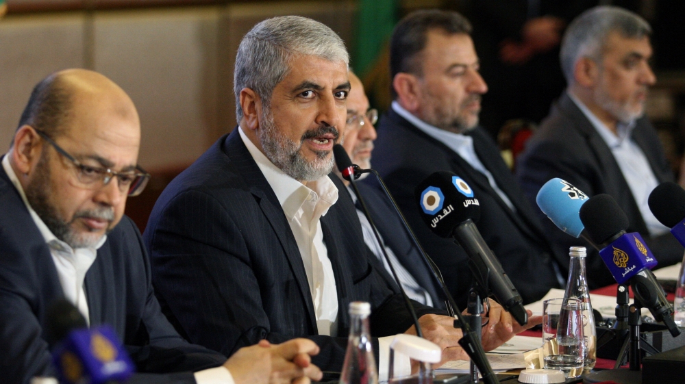 Hamas leader Khaled Meshaal gestures as he announces a new policy document in Doha