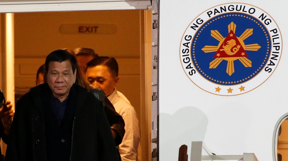 Philippine President Rodrigo Duterte disembarks from a plane upon his arrival at Vnukovo International Airport in Moscow