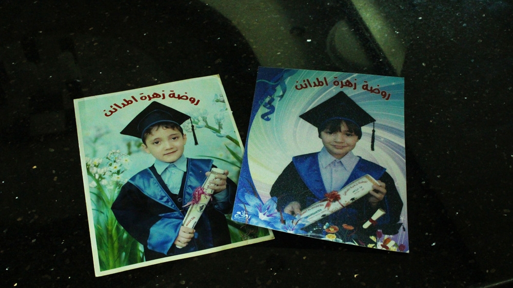 Tailakh has only a few photos of his Gaza-based children in his home in the occupied West Bank [Jaclynn Ashly/Al Jazeera]