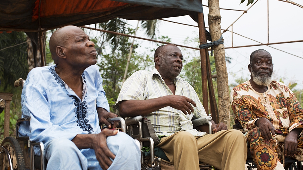 Lawrence Akpu, centre, fought on the Biafran side during the 1967-1970 Nigerian-Biafran War and suffered a spinal cord injury. He is part of the Disabled Biafran War Veterans group [Chika Oduah/Al Jazeera]