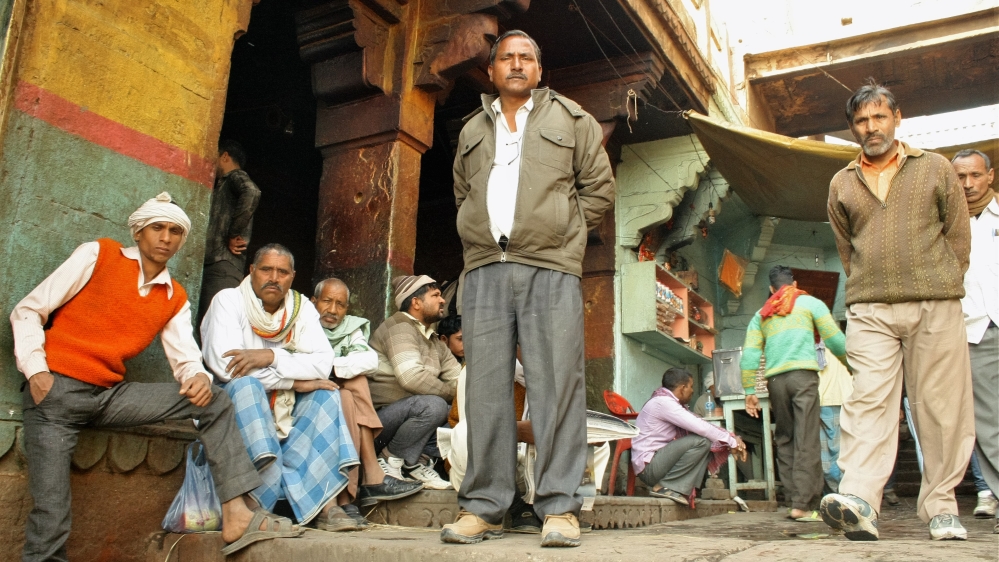 Only men are traditionally allowed to set foot on the Manikarnika Ghat cremation ground; the reason given is that bereaved female relatives could disrupt the solemnity of the place. [Radhika Iyengar/Al Jazeera]