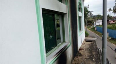 The charred walls of the Kurenegala Mosque after being hit by petrol bombs [Ashar Careem/Al Jazeera]