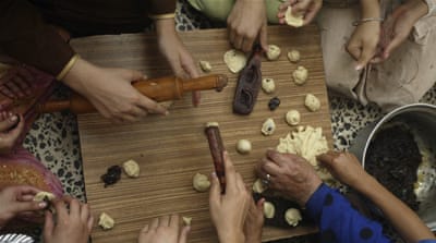 Local women used to come together to prepare traditional sweets [Mohanned Faisal/Reuters]