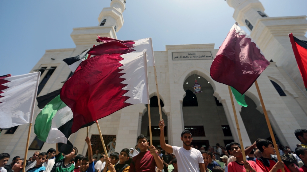 Palestinians take part in a rally in support of Qatar, inside Qatari-funded construction project ''Hamad City'', in the southern Gaza Strip