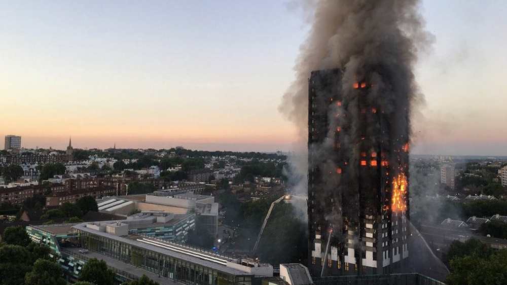 This handout image received by a local resident shows flames and smoke coming from Grenfell Tower