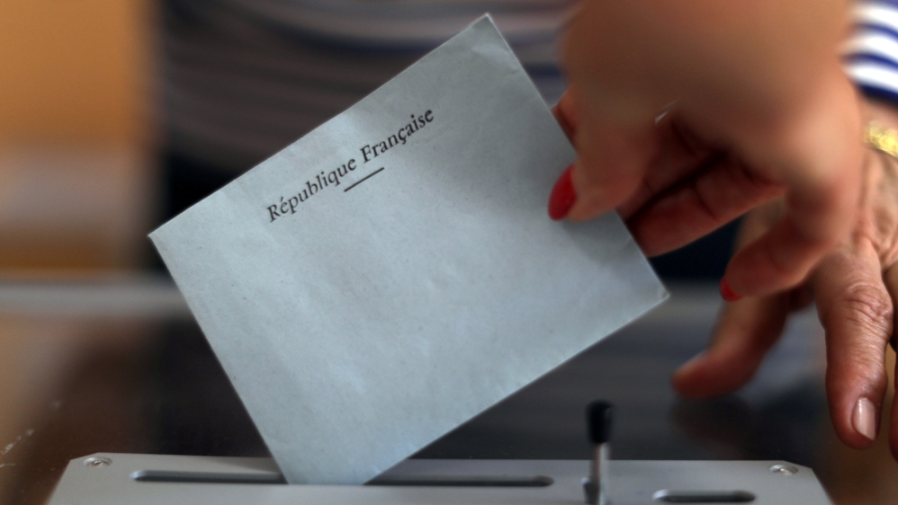 A ballot being cast in a polling station [Eric Gaillard/Reuters]
