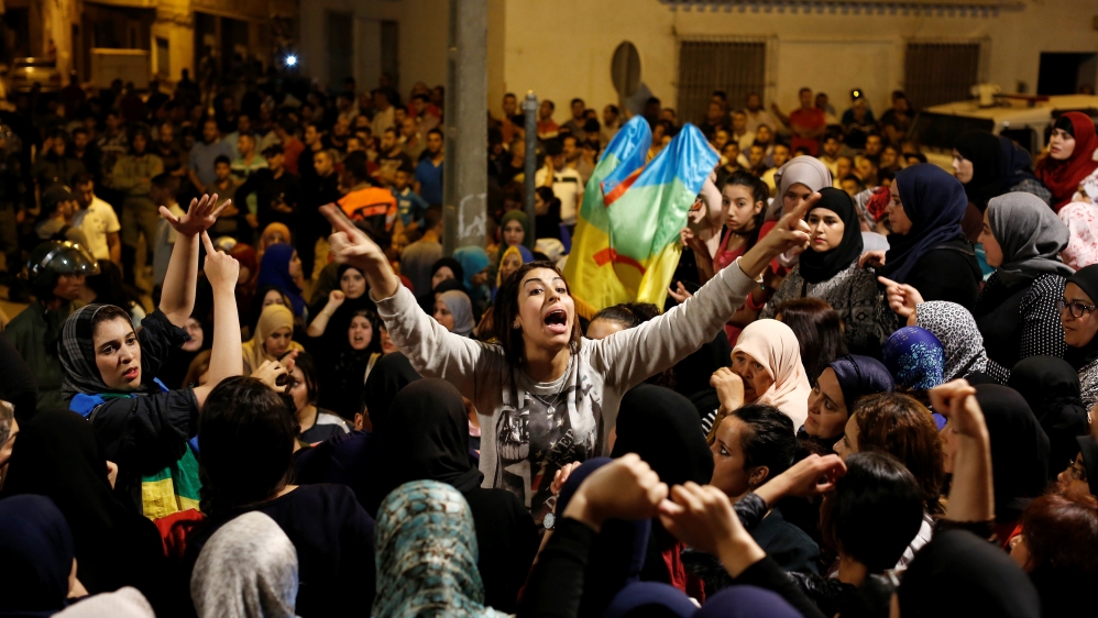 Women shout during a protest against official abuses and corruption in the town of Al-Hoceima