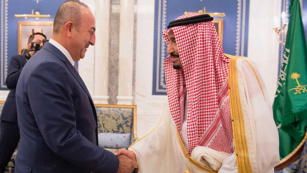 Saudi Arabia''s King Salman bin Abdulaziz Al Saud shakes hands with Turkish Foreign Minister Mevlut Cavusoglu in Jeddah