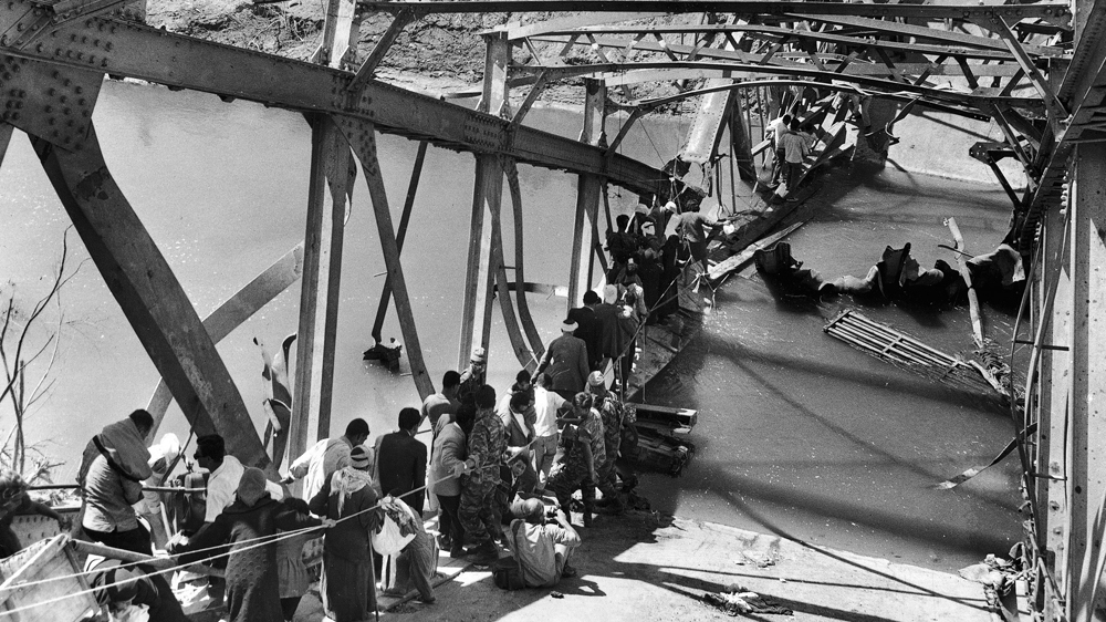 Palestinian refugees flee from the Israeli-occupied West Bank on June 15, 1967 [AP]