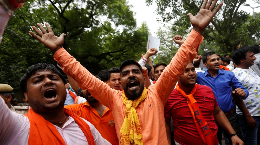 Activists of Hindu nationalist group Vishva Hindu Parishad shout slogans during a protest in New Delhi against the killing of seven Hindu pilgrims in a gun battle that erupted in Kashmir in July [Reuters/Adnan Abidi]